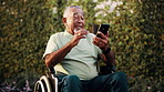 Phone, video call and old man in wheelchair, waving and discussion with contact on social media app. Happy, greeting and senior person with disability, online and virtual chat with mobile in nature