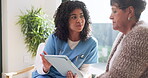 Consulting, conversation and tablet of nurse with old woman on sofa in retirement home for assisted living. Feedback, healthcare app and visit with caregiver speaking to senior patient in apartment