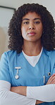 Pride, face or nurse in office with arms crossed, wellness service or ambition in medical career. Portrait, woman or doctor with confidence, clinical practitioner or about us in healthcare industry.