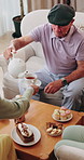 Senior, man and tea party in retirement home with friends, conversation and relax for bonding together. Old people, pour warm drink and talk in living room with gossip, reunion and care for wellness.