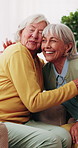 Senior, women and friends in retirement home with hug, conversation and relax for bonding together. Happy, elderly people talk and embrace in living room with visit, reunion and support for wellness.