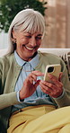 Phone, laugh and senior woman on sofa in home for texting, research or chatting on mobile app. Relax, technology and elderly person in retirement with reading blog, website or social media in house.