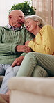 Elderly, couple and conversation in home with love, smile or relax for bonding together in retirement. Happy, married senior people and talk in living room with care, support or romantic relationship