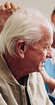 Help, brushing hair and senior man with caregiver in homecare for grooming, clean and hygiene. Elderly person, nurse and support for self care, comb or listen to advice in assisted living home