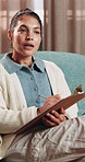 Therapy, psychologist and woman with notes, talking or help with evaluation for rehabilitation. Counseling session, psychiatry or person writing on clipboard for support, mental health or assessment