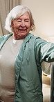 Physiotherapy, stretching and senior woman with smile for health, shoulder rehabilitation and care. Retirement, elderly person and physiotherapist in office with joint mobility and happy for progress