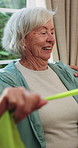Physio, stretching and senior woman with resistance band for health, shoulder rehabilitation or care. Retirement, elderly person or physiotherapist in office with joint mobility or happy for progress