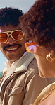 Couple, talk and walk at beach, bonding and summer adventure with partner or anniversary celebration. Outdoor, happy people and travel with spouse on coastal holiday, chat and relationship commitment