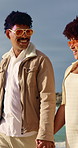 Couple, holding hands and travel at beach, bonding and summer adventure with partner or anniversary. Outdoor, happy people and walk with spouse on coastal holiday, love and relationship commitment