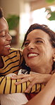 Happy, mom and child with hug in home for love, childhood or mothers day celebration together. Mama, kid or smile with boy, son or embrace for holiday comfort, weekend break or parenthood in house