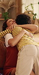 Hug, laughing and mother with son in living room go home for bonding, love or security. African family, connection and smile with boy embracing happy woman in apartment for development or support