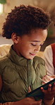 Mom, child and tablet on sofa for elearning, bonding and educational app in home. African family, woman and son with tech for streaming subscription, growth and online development for boy in house
