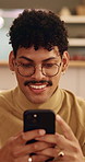 Cellphone, relax and man on sofa in home with texting, chatting or communication on social media app. Happy, technology and person with phone for typing email inquiry on website in apartment.