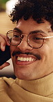 Phone call, glasses and man on sofa in home for communication, catch up or funny joke. Laugh, cellphone and person on comic mobile conversation, connectivity or contact on weekend in apartment.