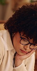 Thinking, serious and woman in home with decision on university scholarship with rejection. Glasses, bad news and student with doubt for college application with choice, memory or solution in house.