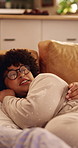 Watching tv, love and couple cuddle in home, bonding or relax together with entertainment. Happy man, woman and chill with remote in living room for streaming service, talk or connection with partner