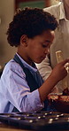 Learning, parent and child baking in kitchen, mix ingredients and chocolate dough preparation. Mother, boy and cooking at home with bowl for cupcake recipe, help and teaching kid with family support