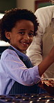 Face, mother and happy child in kitchen for baking, mix ingredients and chocolate dough preparation. Parent, boy and cooking at home with bowl for cupcake recipe, help and teaching kid with smile