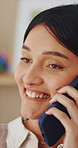 Happy, woman and conversation in home with phone call, relax and listen to gossip on weekend break. Female person, smile and contact in house with tech, internet or network for digital communication.