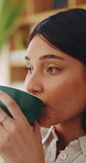 Planning, coffee and woman in home for relax, calm or peaceful morning with ideas for day. Thinking, reflection and person drinking warm beverage for nostalgia, memory or remember in living room.