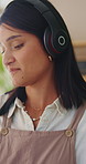 Music, dancing and happy woman in home living room with fun energy, smile and playlist. Student, female person and audio equipment for streaming, good mood and beat on headphones with rhythm or moves