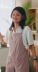 Headphones, dancing and happy woman in home lounge with energy, smile and listen to music playlist. Student, female person and audio equipment for streaming, good mood and beat with rhythm and moves