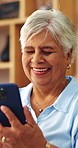 Laugh, old woman and scroll with phone in home for online puzzle, memory test or funny word search. Joke, senior person and happy with mobile for playing bingo game, digital literacy and gambling app