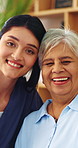 Face, caregiver and elderly woman in nursing home with smile, assisted living or medical support. Portrait, house or person in retirement with nurse for hug, homecare service or laugh with healthcare