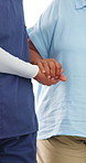 Nurse, senior and holding hands with patient for mobility, walking aid or assisted living in home. People, healthcare worker or caregiver helping person with a disability for elderly care or recovery