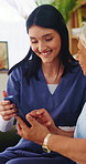 Caregiver, help and old woman in home with phone, discussion or happy for website navigation tips. Nurse, senior person and talk on sofa with how to setup tech, app or assistance for digital literacy
