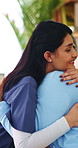 Comfort, happy nurse and hug with old woman in home, laugh and assisted living with medical care. Embrace, house and person in retirement with caregiver for support, homecare gratitude or healthcare