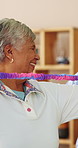 Elderly, therapist and happy woman with resistance band for flexibility or stretching exercise. Female person, physiotherapist and senior patient with smile or arm workout for health or wellness