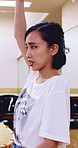 Japanese woman, teacher and studio with drum sticks in class for taiko tradition, culture or practice. Learning, asian musician or female person with skill for music lesson, sound or percussion art