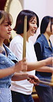 Taiko, practice or people in class with drums, cultural activity or audio coordination in band performance. Percussion, tradition or team with instrument, synchrony rehearsal or music lesson in Japan