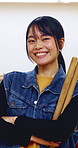 Japanese woman, teacher and face with drum sticks in class for taiko tradition, culture or practice. Portrait, asian musician or female person with smile for music lesson, sound or percussion art