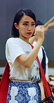 Taiko, woman and group playing drums in studio for performance practice, coordination or culture. Talent, asian female band or serious drummer with bachi for percussion, festival rehearsal and rhythm