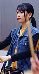 Taiko, practice or Asian woman in class with drums, tradition or audio coordination in band performance. Percussion, culture or musician with instrument, synchrony rehearsal or music lesson in Japan.