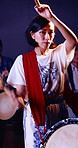 Taiko, face and woman with drums for practice, rehearsal or learning cultural choreography. Bachi percussion, portrait and person in Japanese band for sound coordination, performance or rhythm.
