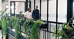 Walk, discussion and business men in office for property development, feedback or proposal. Conversation, broker and realtor in hallway for planning, teamwork or valuation at real estate agency