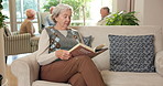Relax, reading book and elderly woman on sofa in retirement home with story, literature or poetry. Senior person, novel and hobby in living room for fiction, learning and knowledge on couch in house