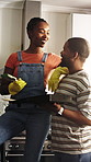 Couple, paint and renovation in house with support, planning or discussion for DIY makeover together. Happy, black people dating and talk in kitchen with paintbrush, remodeling project or maintenance