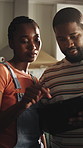 Couple, talk and planning in new house with tablet, online shopping and research for interior design. Black people, dating and moving in home with tech, ecommerce app and discussion for decoration.