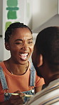 Couple, paint and laugh in house for renovation, funny discussion and bonding together for DIY makeover. Happy, black people dating and talk in kitchen with paintbrush, remodeling project and humor.
