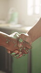 Paint, handshake and agreement with people in kitchen for remodeling success, project and partnership. Home improvement, shaking hands and thank you with contractor and client in house for help