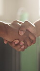Painter, handshake and meeting with people in kitchen for remodeling success, project and partnership. Home improvement, shaking hands and thank you with contractor and client in house for help