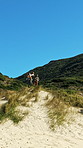 Hiking, men and high five for success on mountain for goal, target or achievement on adventure. Trekking, friends and people with fist pump outdoor for celebration, yes or support  with mockup space