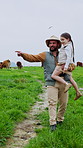 Girl, dad and carry with agriculture, cows and count together with cattle inventory in field. Farmer, family and parent with daughter for sustainability report with herd tracking, support or bonding