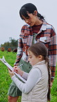 Mother, daughter and clipboard with count on farm for cattle inventory, agriculture and support. Sustainability report, animal herd tracking and bonding with woman and child in cow field for growth