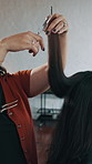 Woman, stylist and hands in salon for haircut, hair maintenance and grooming service. Client, hairdresser and scissors in beauty parlor for trimming, customer experience and haircare for makeover