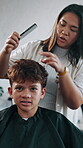 Comb, hairdressing and woman with boy customer in shop for change, consulting or styling. Conversation, service and small business with hairdresser cutting hair of teenager in salon for appointment